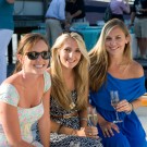 SCENE members enjoying cocktails on a yacht.